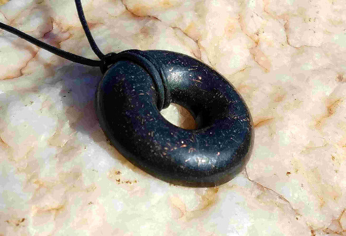 black sun Andy's Black Sun Orgonite® Donut Pendant Necklace comes with a 30" black leather necklace This EMF protective Orgone Jewelry