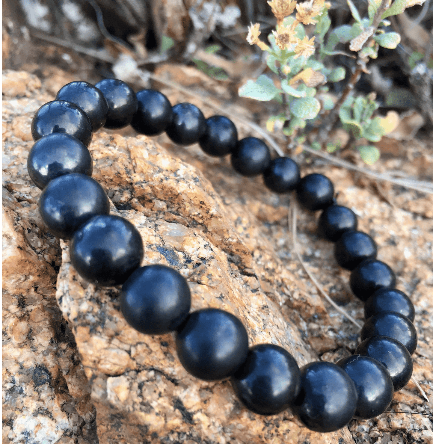 Shungite Jewelry is handmade in Karelia, Russia. This beaded bracelet has several polished 8mm round beads strung on a strong standard size elastic band