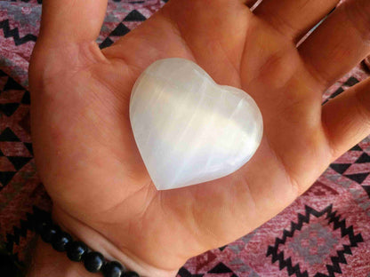 White Selenite Puffy Heart – Reiki Healing Crystal & Energy Cleanser held in hand, ideal for meditation, energy work, and spiritual protection.