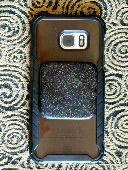 Andy's Black Sun Orgonite® Buttons protect and  shield you from harmful EMF Pollution. These Orgone Generators® are designed to fit on your cell phone case. Each Black Sun Button contains Andy's famous "Black Sun Blend"