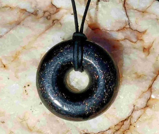 Andy's Black Sun Orgonite® Donut Pendant Necklace comes with a 30" black leather necklace  This EMF protective Orgone Jewelry 