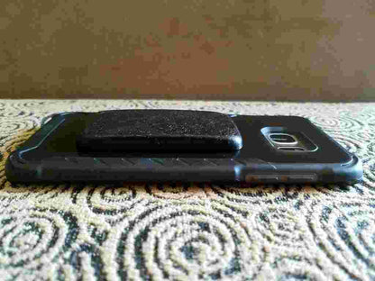 Andy's Black Sun Orgonite® Buttons protect and  shield you from harmful EMF Pollution. These Orgone Generators® are designed to fit on your cell phone case. Each Black Sun Button contains Andy's famous "Black Sun Blend"