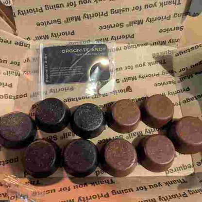 Box of Andy's Black Sun Orgonite® Tower Busters, powerful orgone generators for EMF protection and energy.