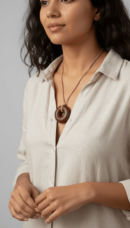 Lifestyle portrait of woman wearing Sedona Red Rock Orgonite pendant necklace