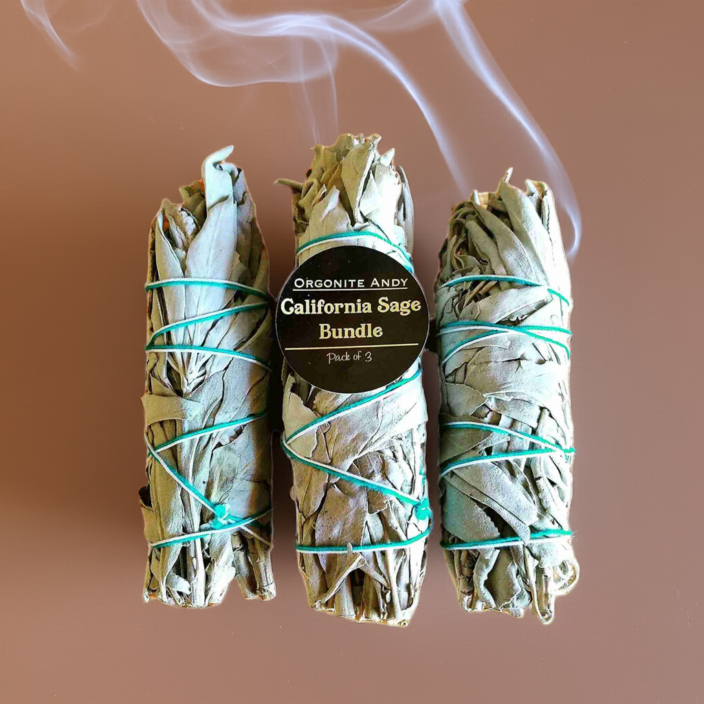 Three California white sage smudge sticks tied with cotton twine for energy cleansing