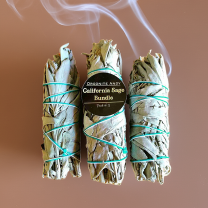 Three California white sage smudge sticks tied with cotton twine for energy cleansing